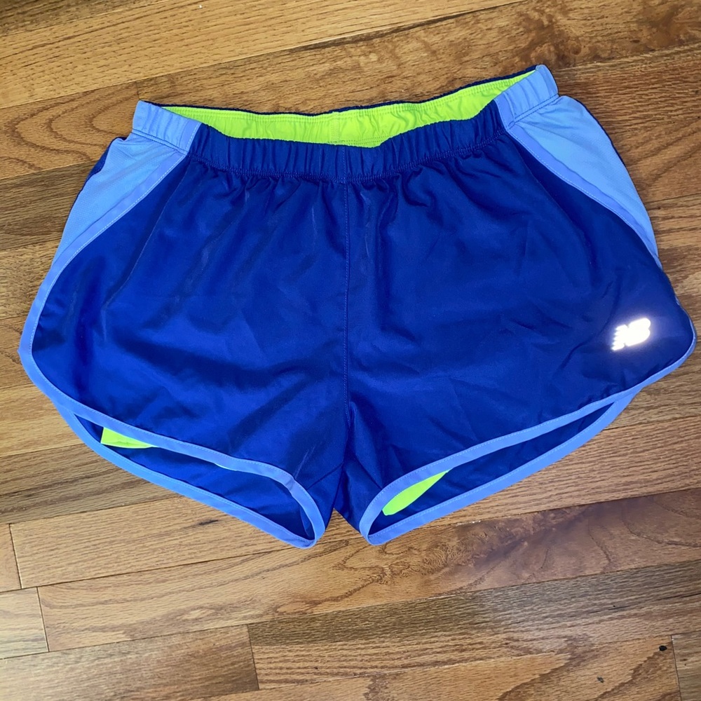 Purple new balance shorts with neon lining